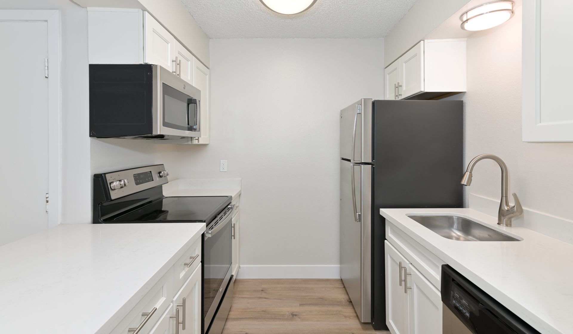 Kitchens features stainless steel appliances and updated cabinetry